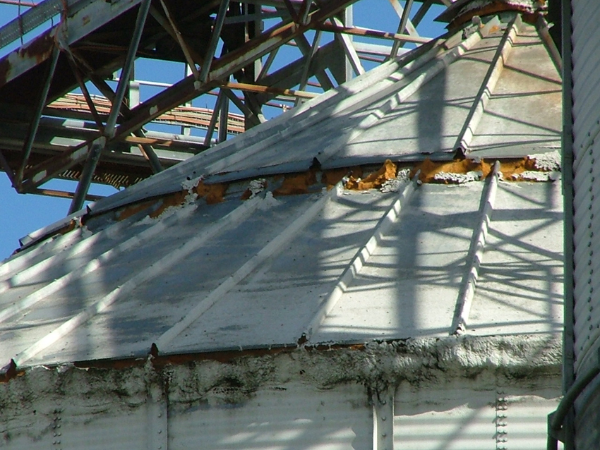 Step 2: Legacy rigid polyurethane spray foam at the roof-to-wall eave and horizontal step-down roof joint ha