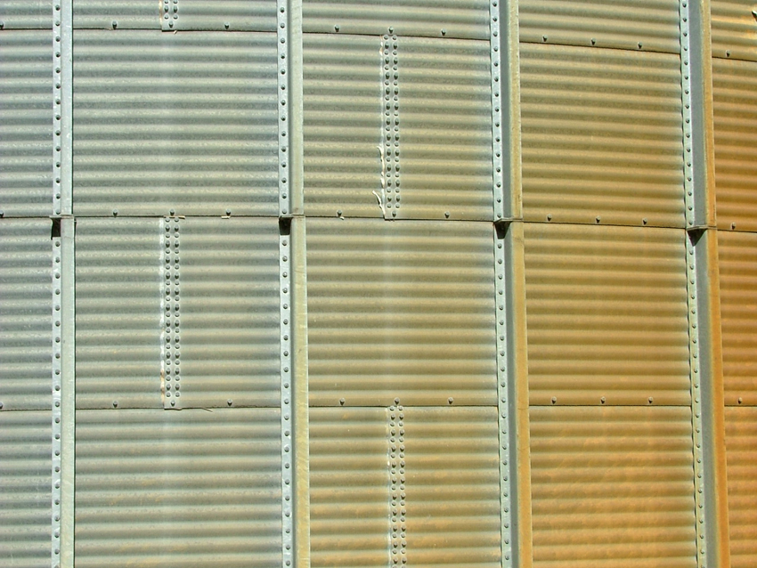 Step 3: Original construction mastic has become brittle and is detaching from wall joints; orange staining i